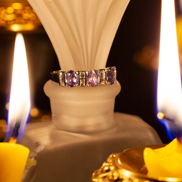 18k white gold ring with three oval natural alexandrites and baguette diamonds, showcasing color-changing gemstones and elegant design.